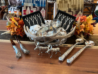 Tabletop items for entertaining guests, such as nice silverware and silver salt and pepper shakers